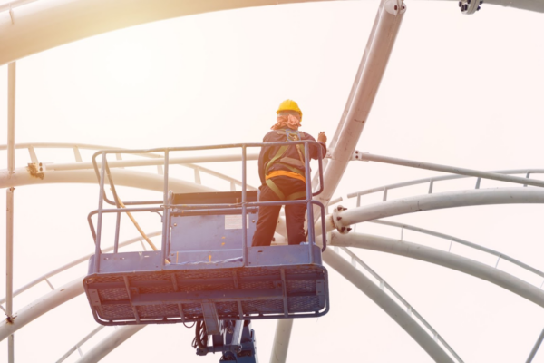 A person working on a crane.